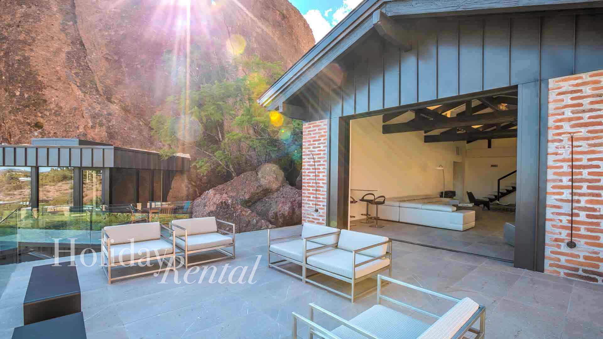 luxury vacation rental on camelback mountain living space connecting to outdoor sitting are