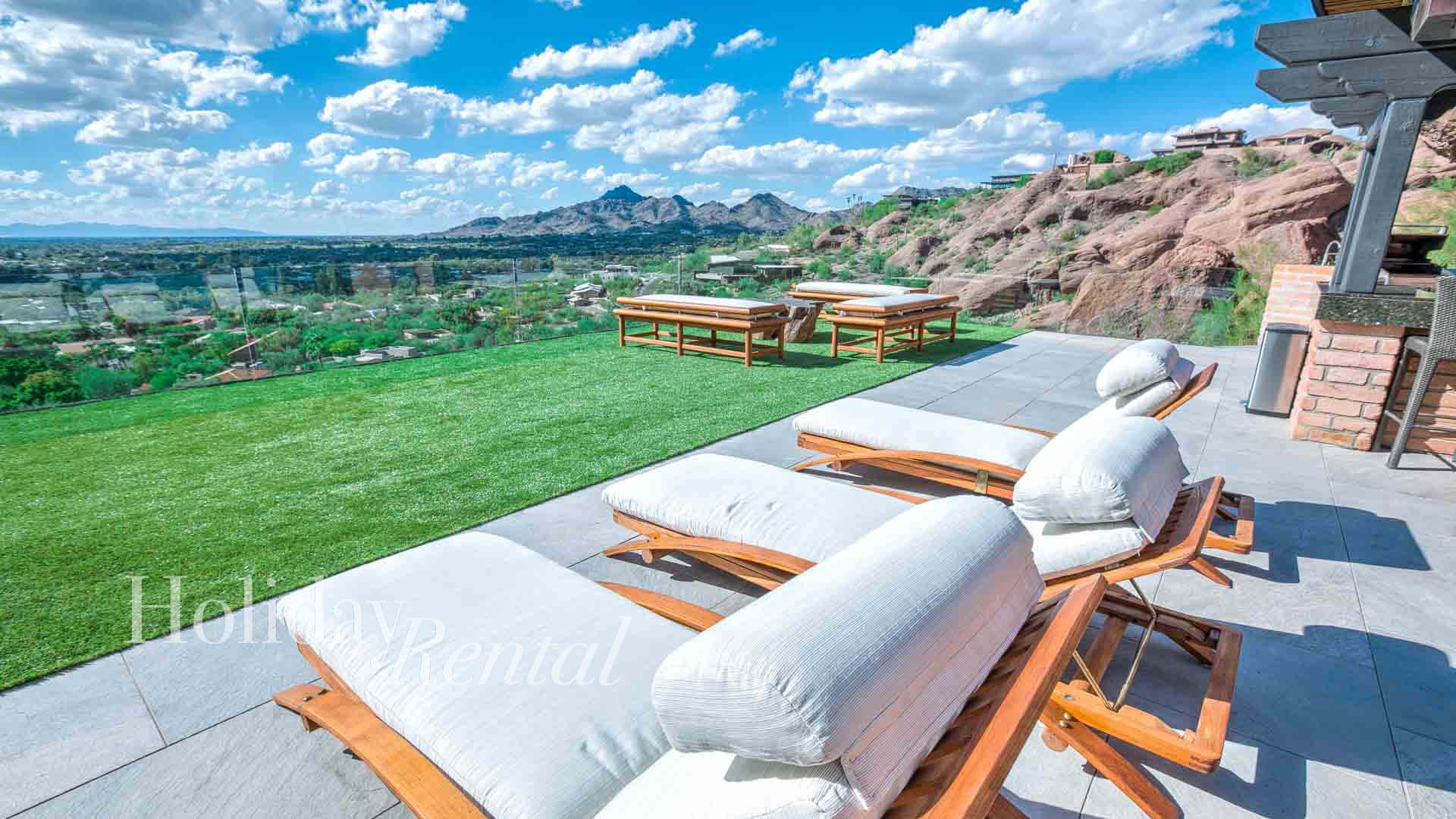 luxury vacation rental outdoor lounging seats with city views